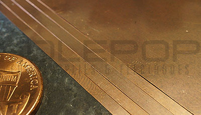 Overlapping sheets of copper-tungsten plate.