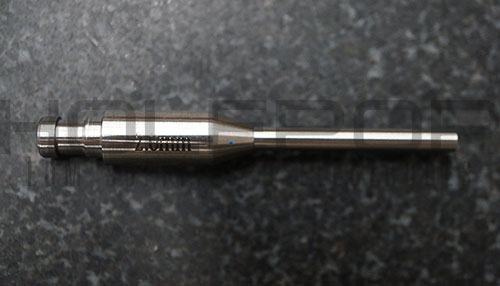 A custom silicon nitride guide with a tapered tip and hypodermic extension.