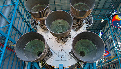 Five F1 rocket engines attached to Saturn V rocket.