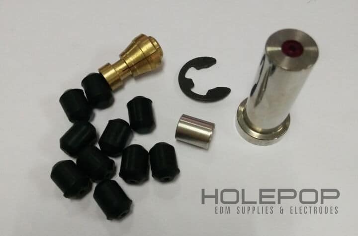 An Agie-Charmilles/AgieDrill 054-0014 Ruby Guide Set including a guide, collet, retaining clip, compression sleeve, and rubber grommets.