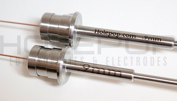 Engraved custom silicon nitride guides with hypodermic extensions.