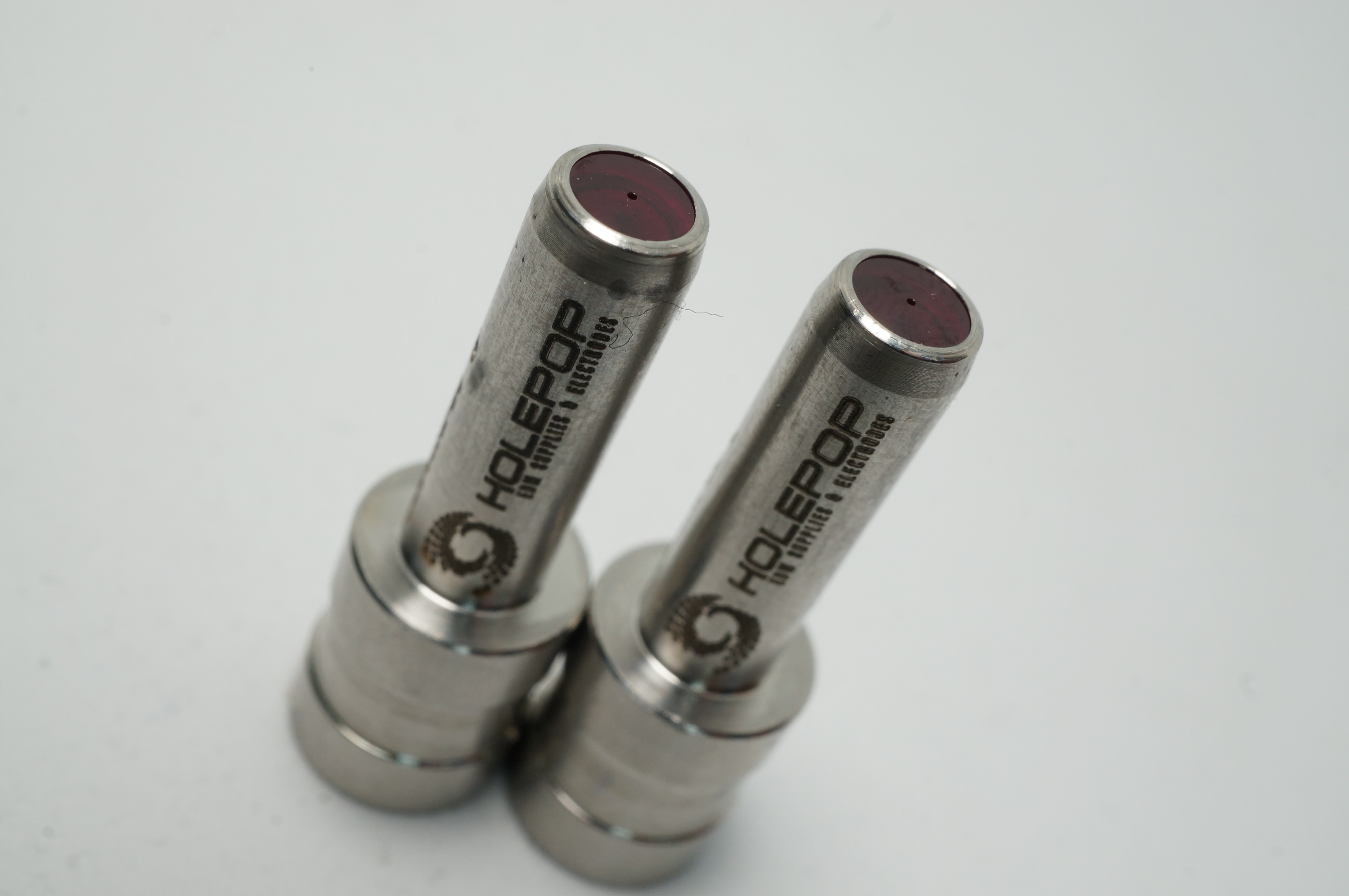Durable sapphire guide for EDM drilling.